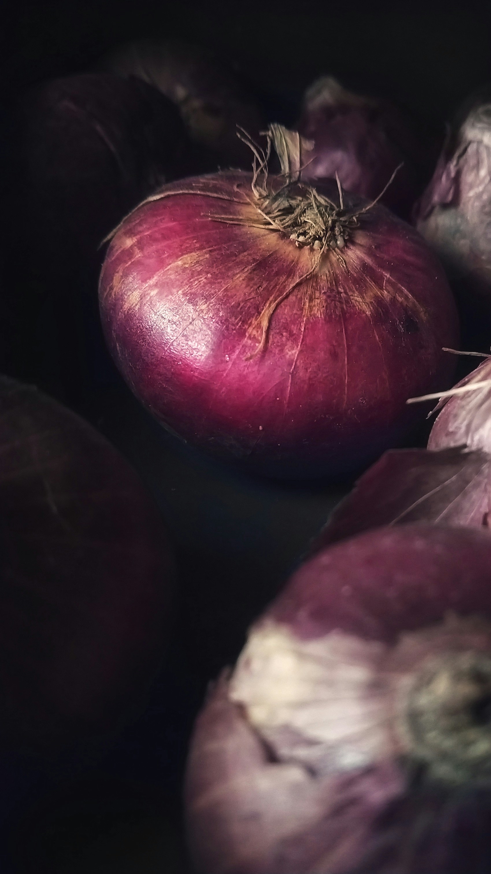 red onion on black surface